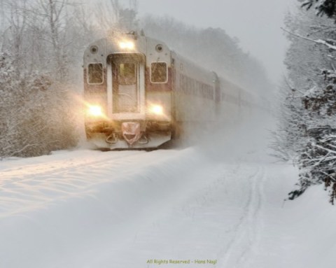 Franklin Line T Commuter Rail making its way through the heavy blizzard snow